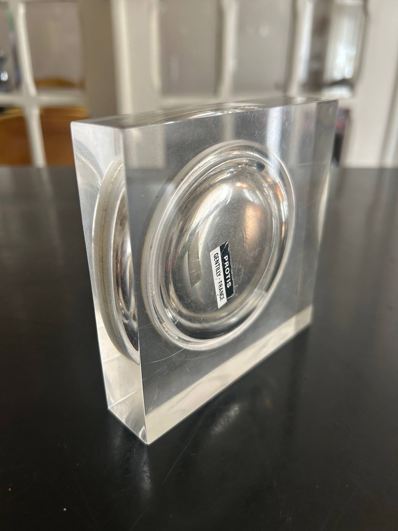 Plexiglass pocket emptier 1970