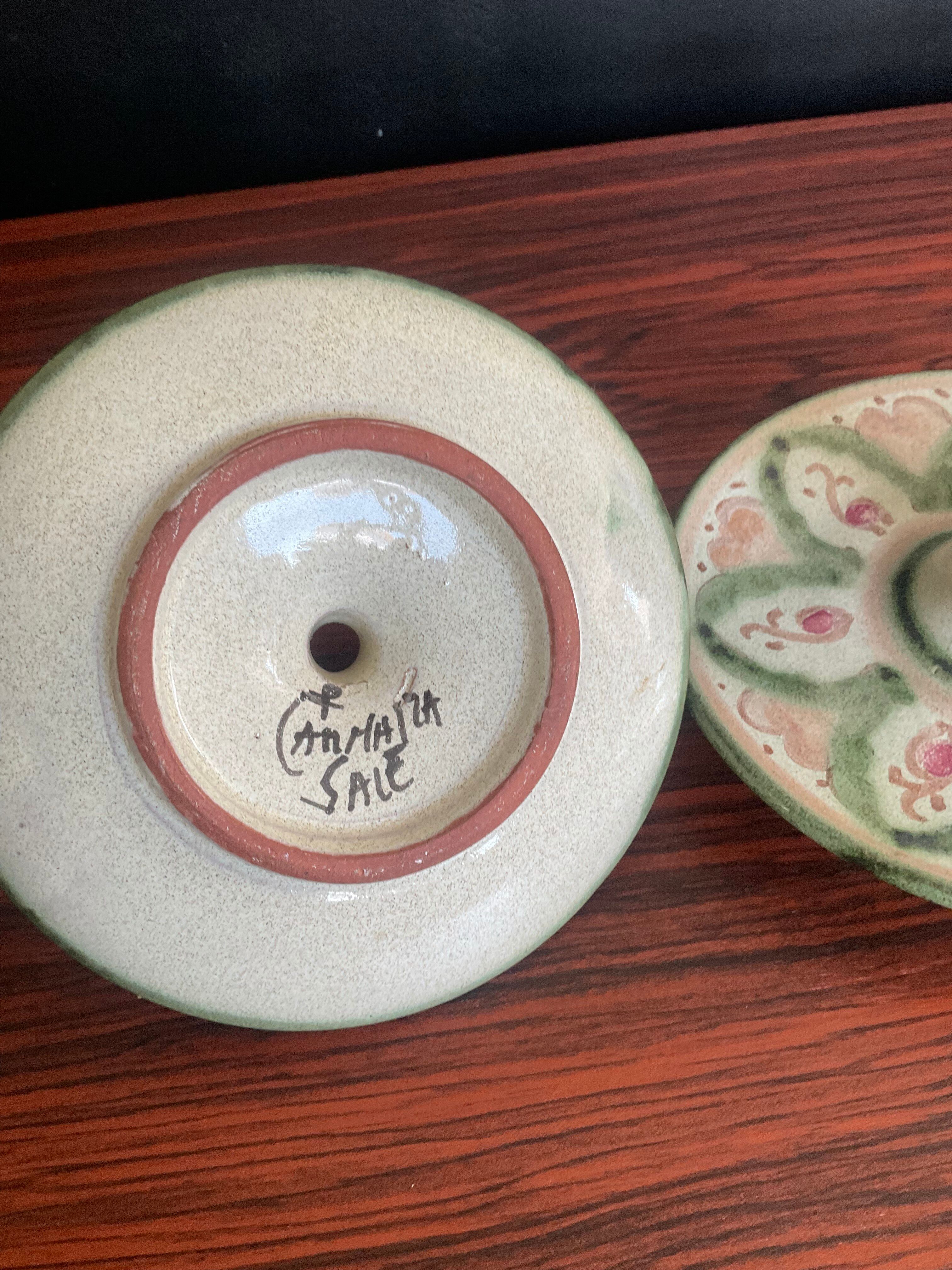 Pair of vintage cave rat candlesticks in glazed terracotta