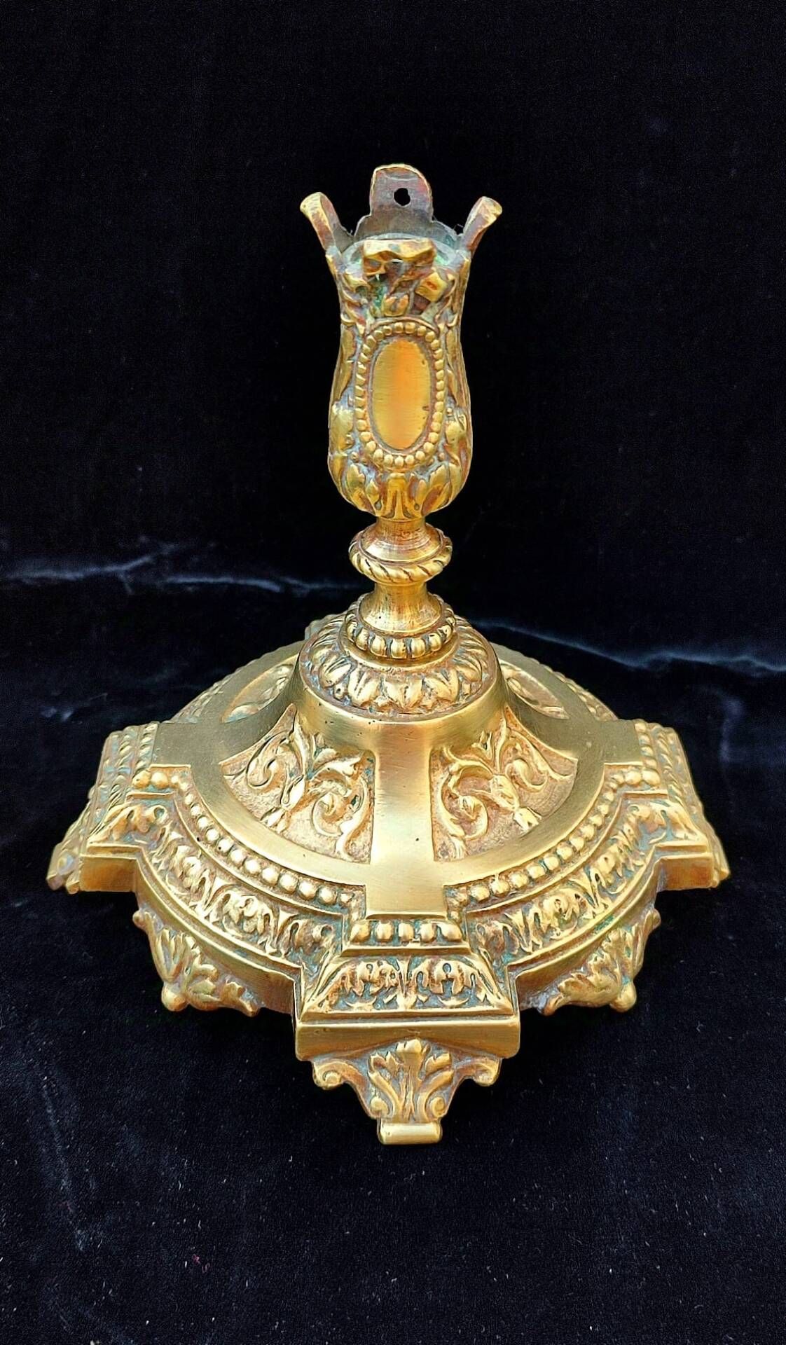 Pair of antique carved bronze candlesticks.