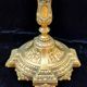 Pair of antique carved bronze candlesticks.