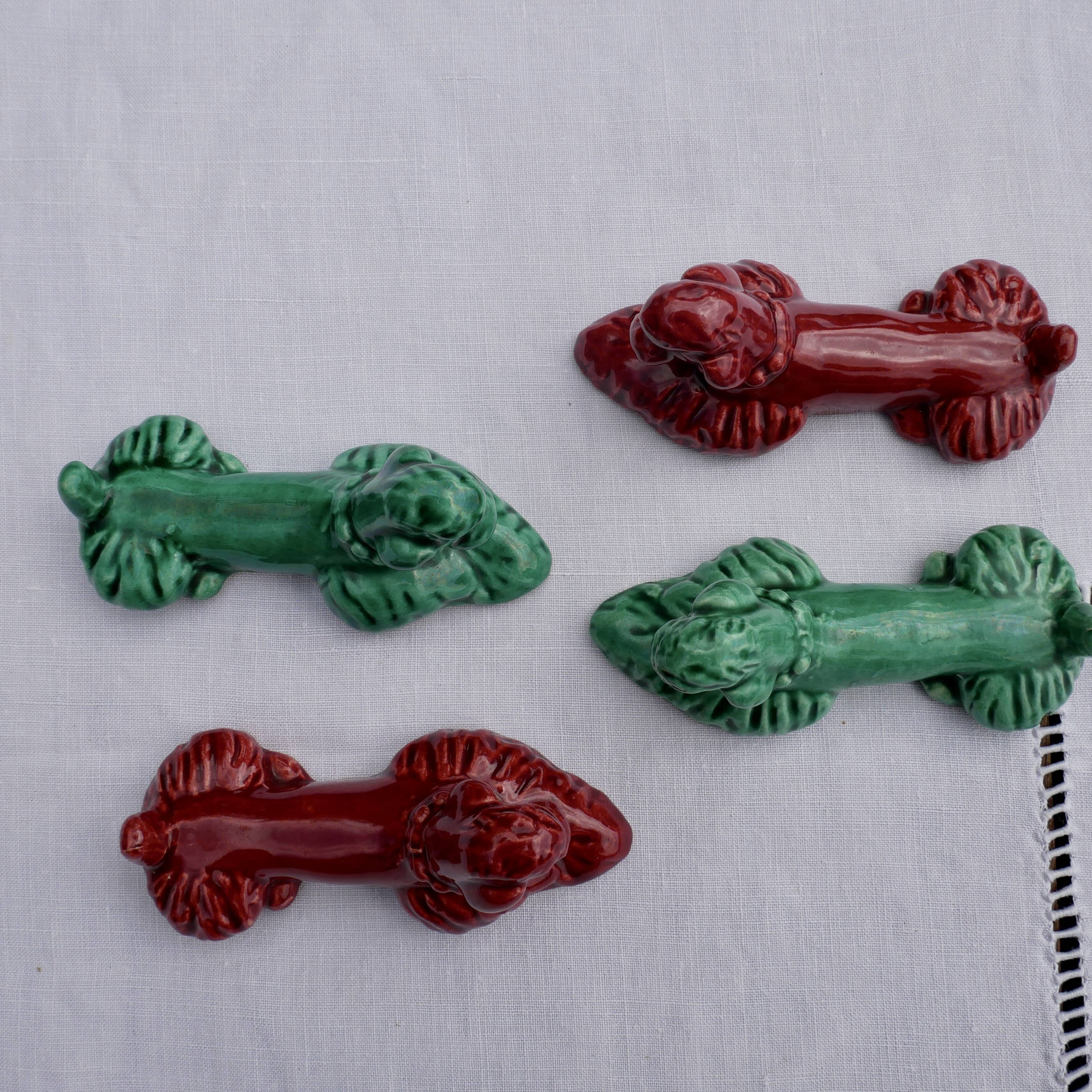 4 knife holders in the shape of poodles