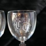 A pair of engraved crystal wine glasses