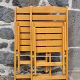 Pair of folding chairs in blond wood