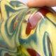 Brown, yellow and green marbled ceramic vase