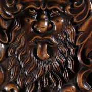 17th century Alpine carved walnut Brettstuhl armchair with grotesque mask
