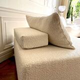 Square ottoman and its cushions in buckle fabric