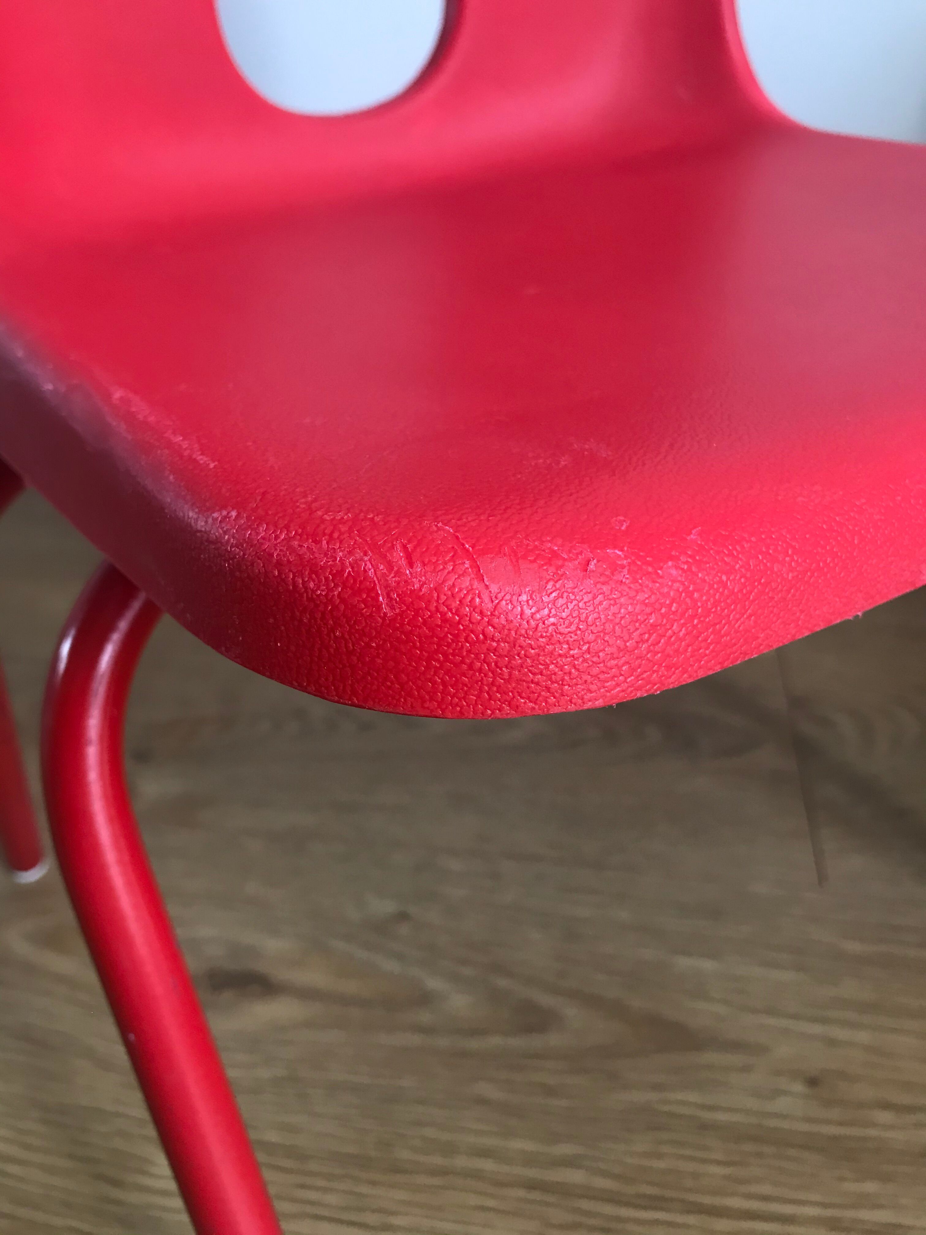Red child chair by robin day for ikea