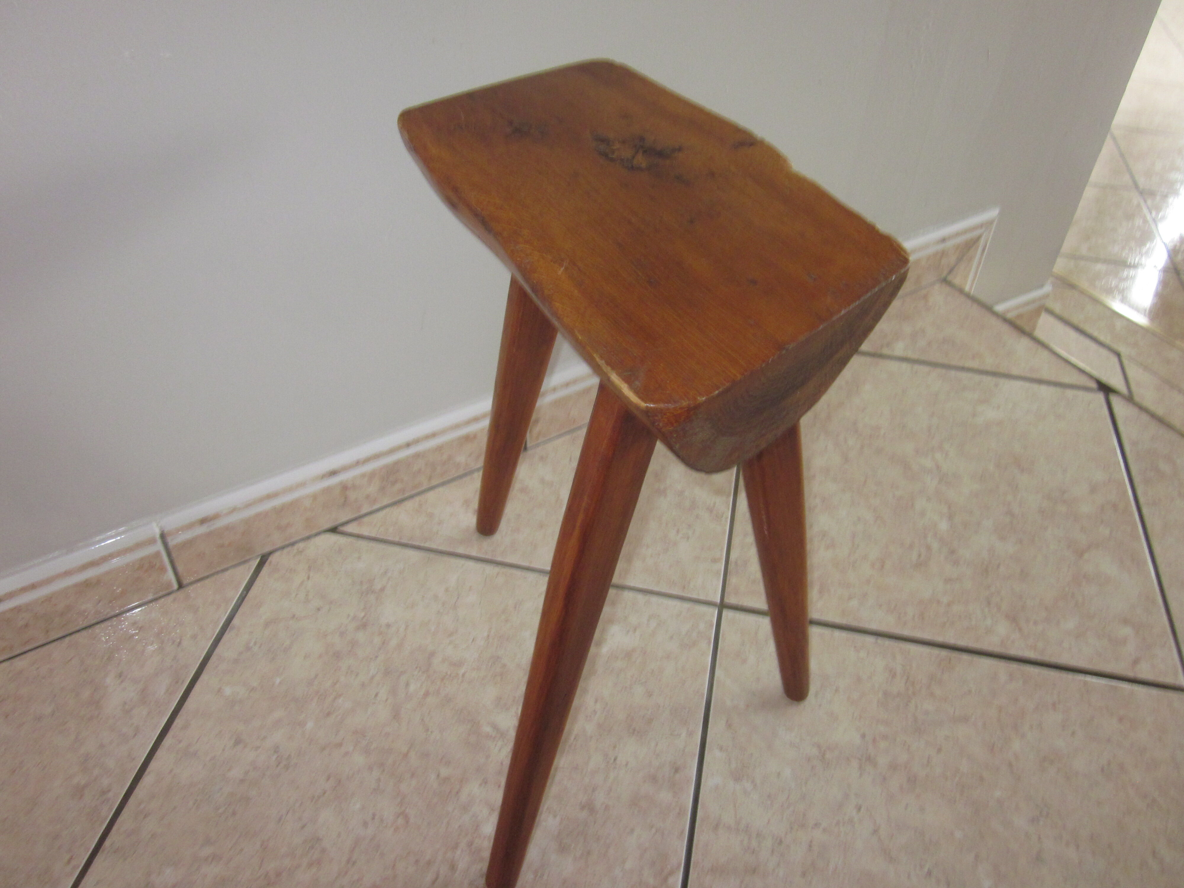 Raw wooden tripod stool