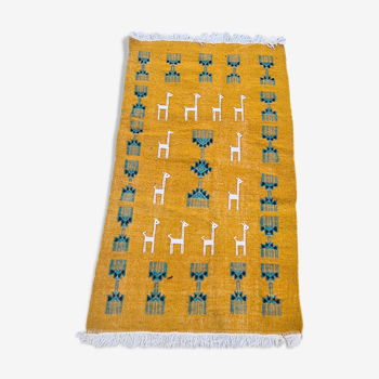 Traditional handmade gazelle-patterned carpet in pure wool