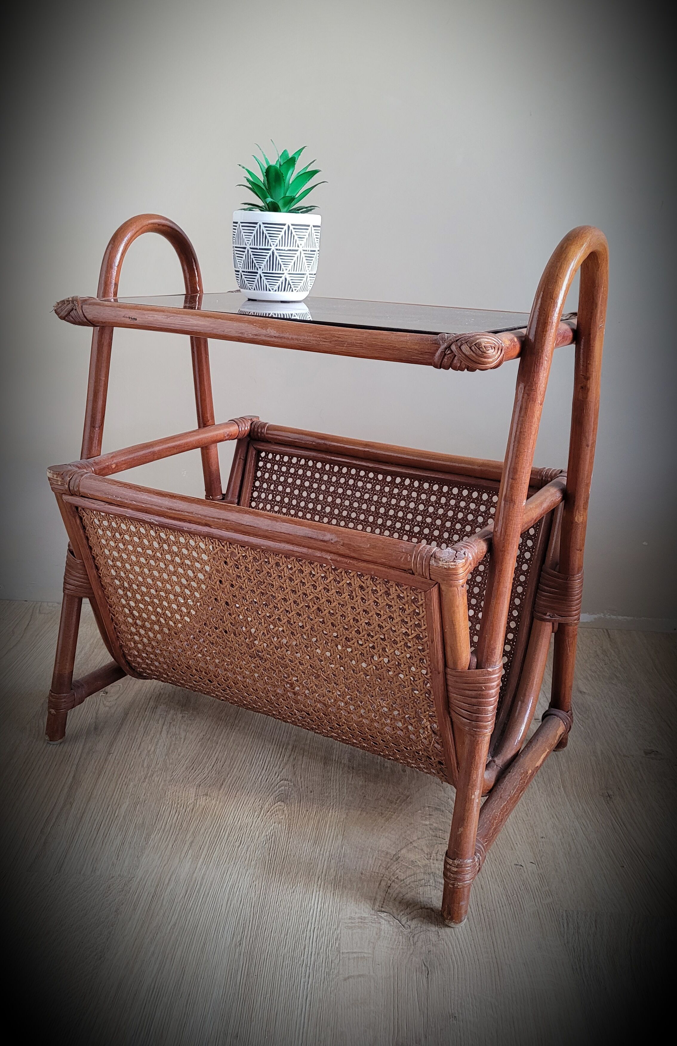 Braided rattan side table and smoked glass