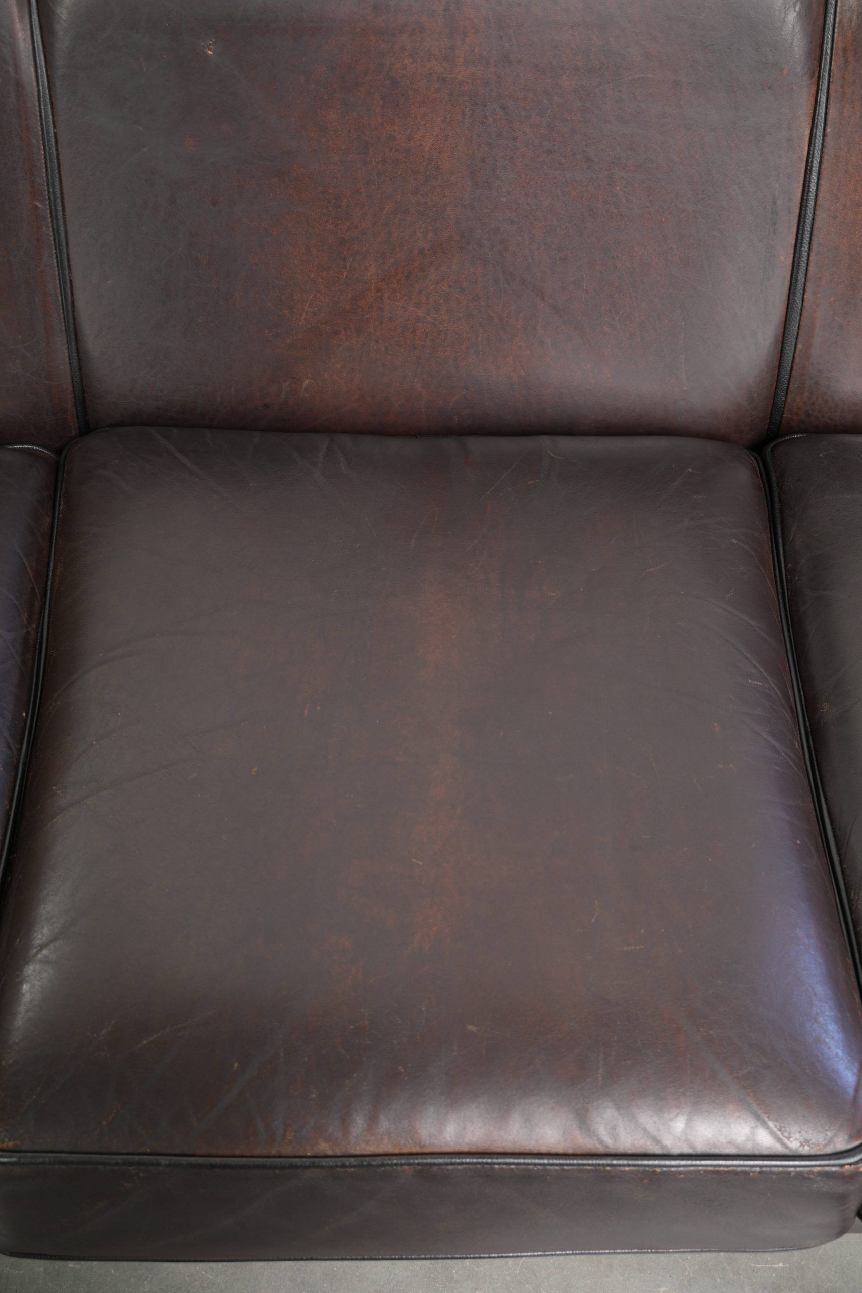 Unique sheepskin 3-seater sofa with deep colours and a distinctive design