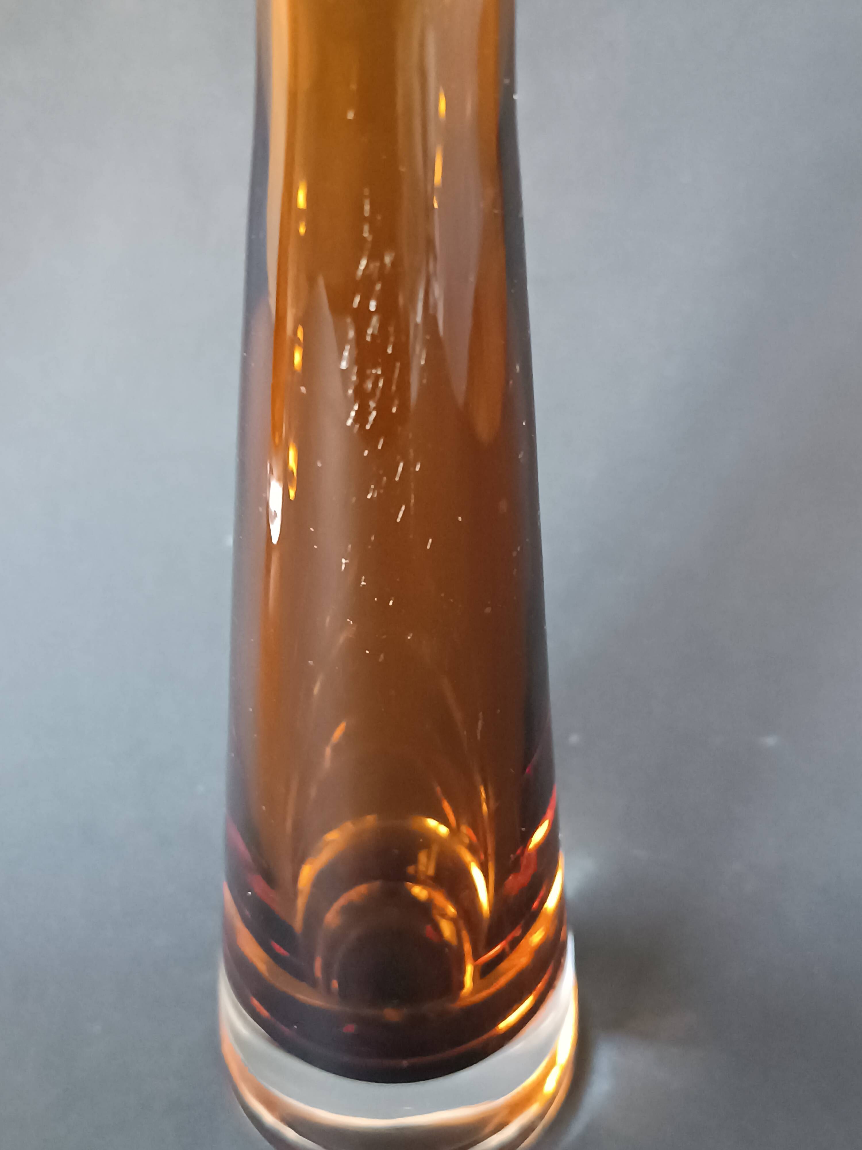 Two vintage Scandinavian double-layered amber blown glass candlesticks