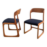 Pair of vintage Baumann sled chairs with curved wood in honey colour.