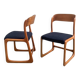 Pair of vintage Baumann sled chairs with curved wood in honey colour.