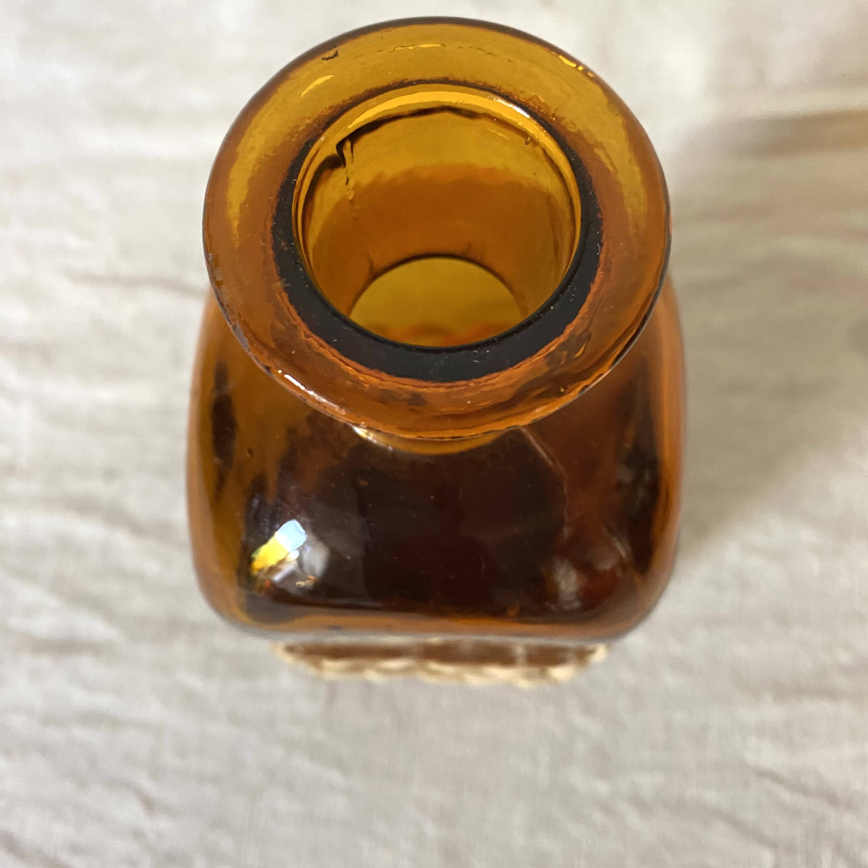 Amber glass and rattan carafe