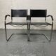 Pair of design armchairs in imitation leather chrome