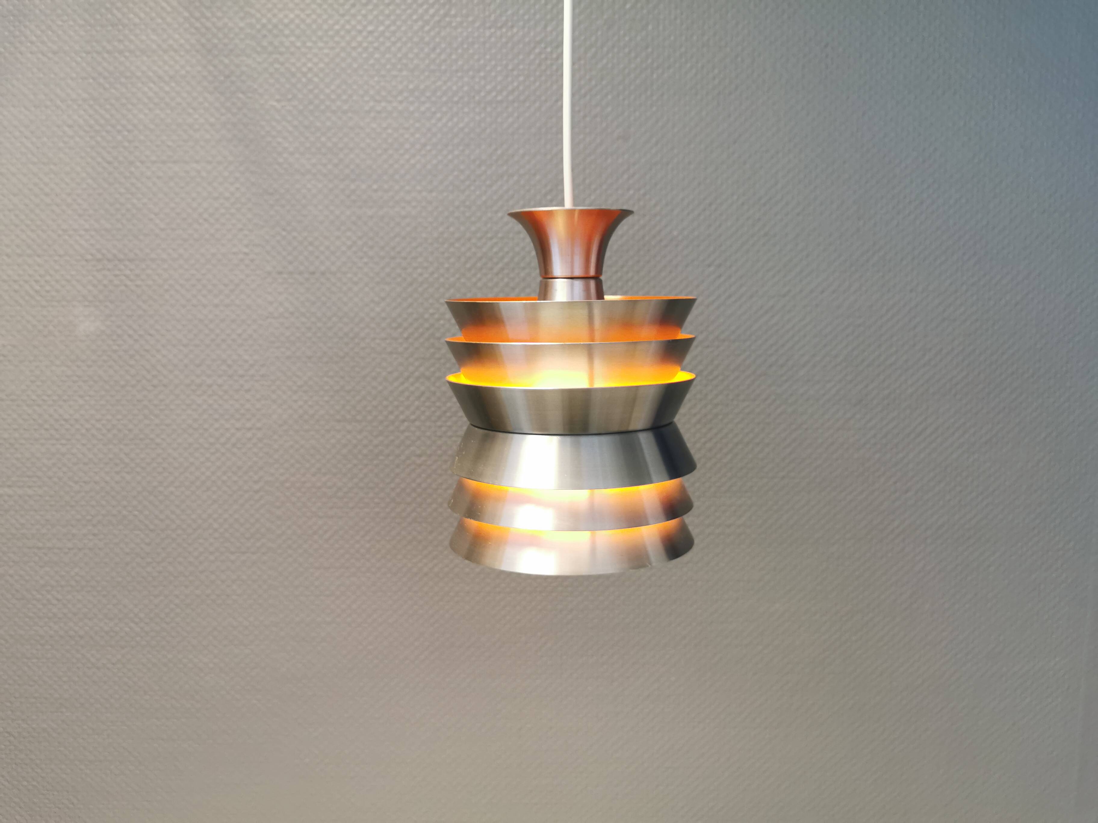 Danish/Swedish hanging lamp, in silver-coloured aluminium with orange interior paint.