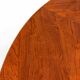 Large round dining table with black blade legs.