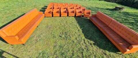 Pair of vintage orange leather armchairs