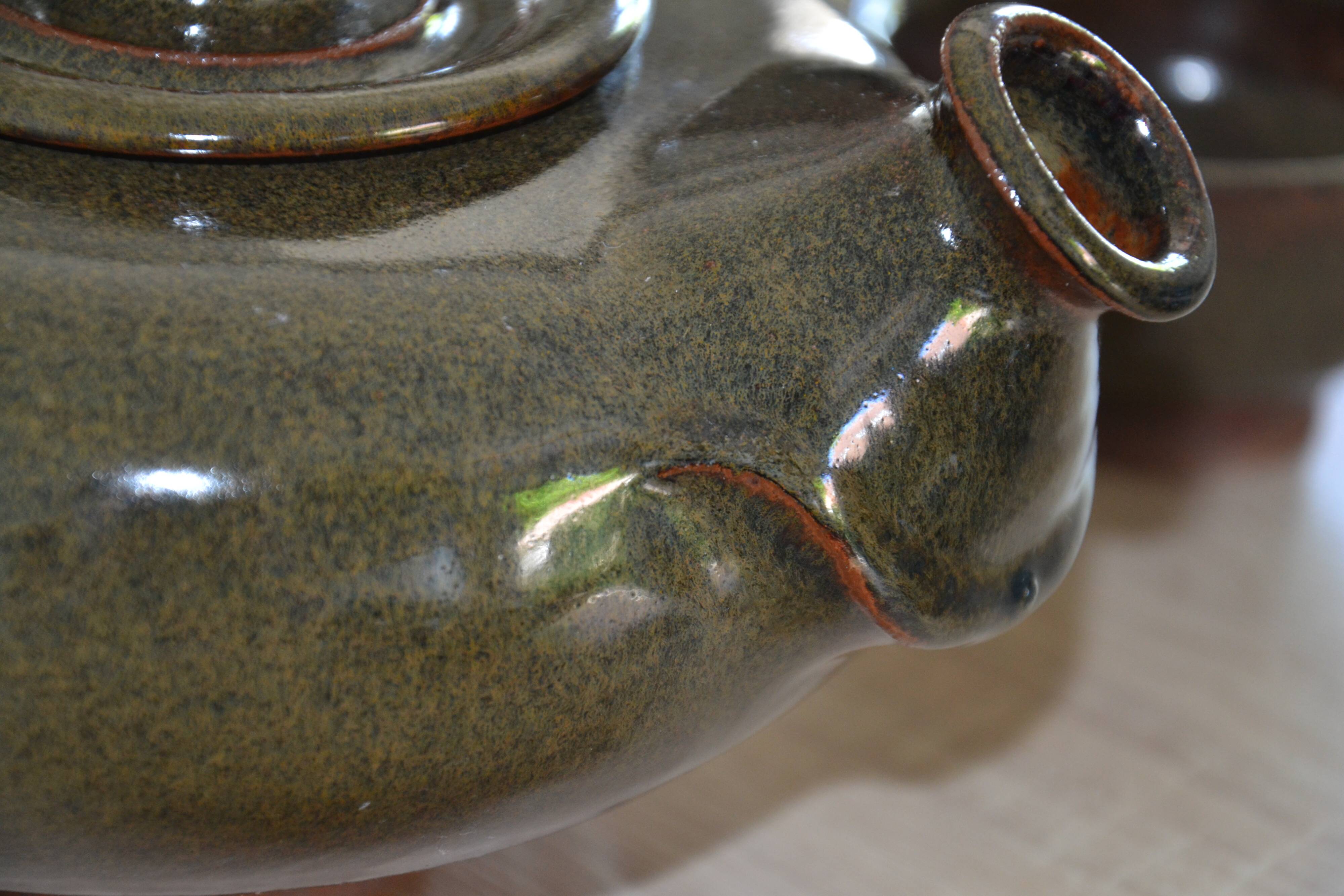 Antique stoneware teapot and its six signed bowls
