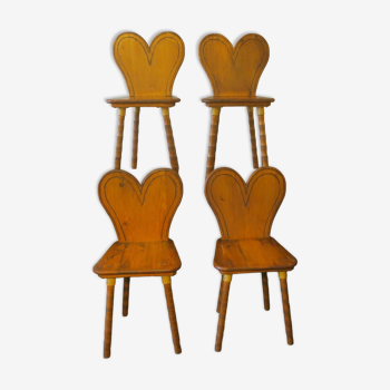 Set of 4 mid century chairs with heart-shaped backs and splayed legs