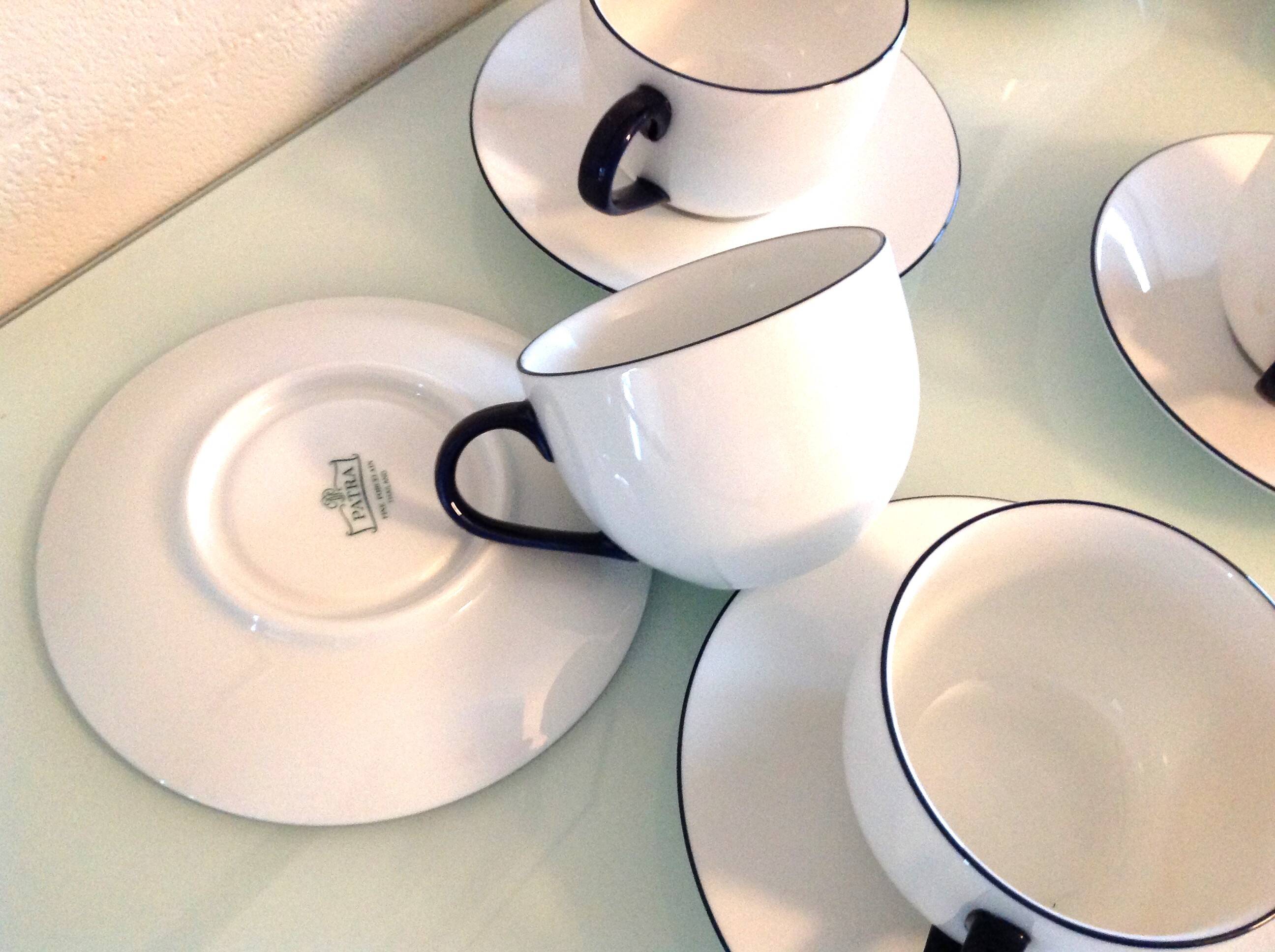 Set of eight white porcelain cups with blue edging / vintage 70s-80s