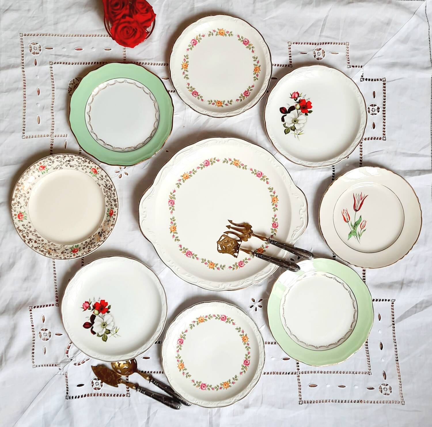 Old mismatched earthenware dessert plates with gold accompanied by a dish