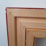 Framed black gilded wood and cream fabric