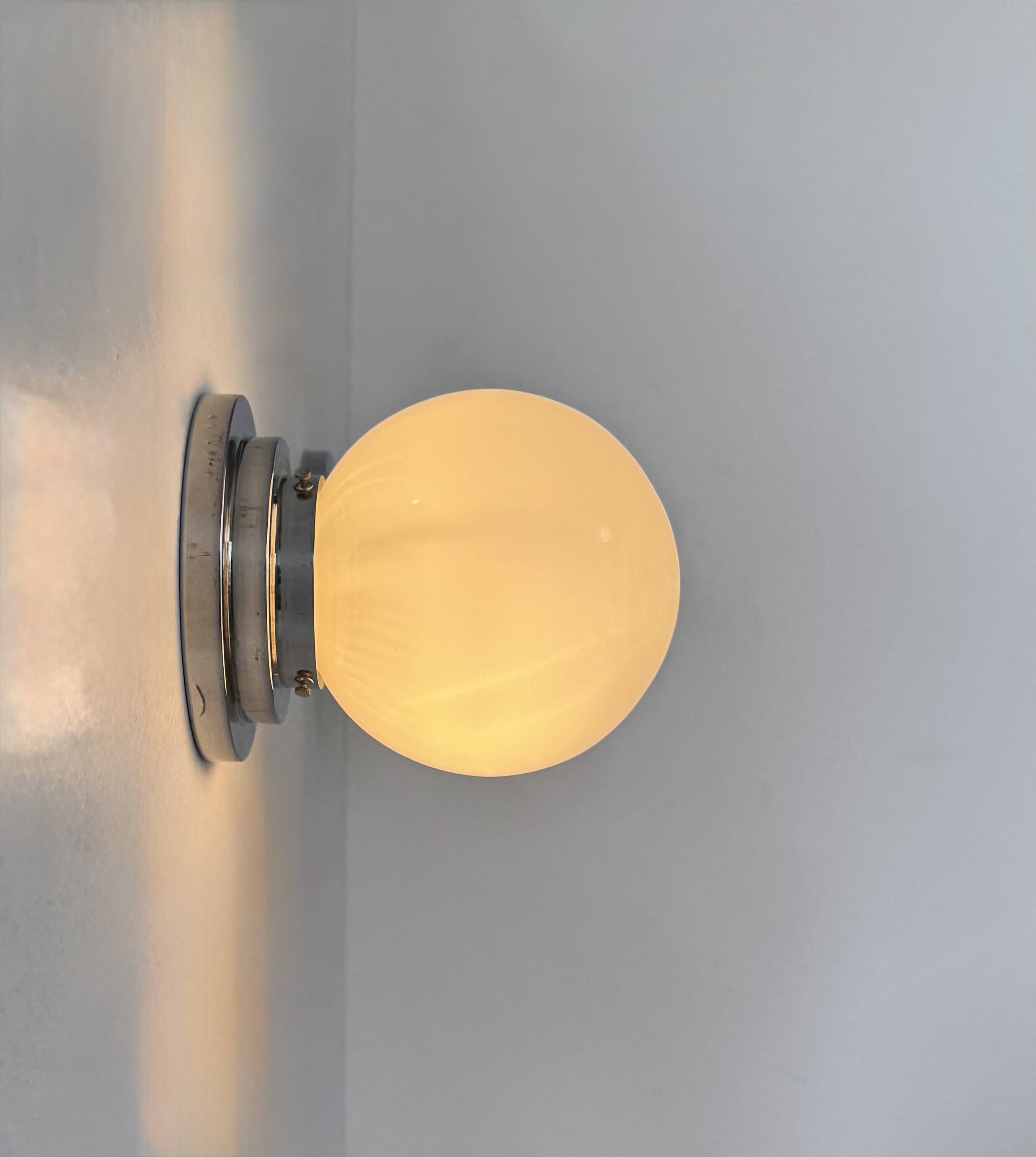 Pair of vintage modernist Art Deco wall lights, chrome and opaline, France