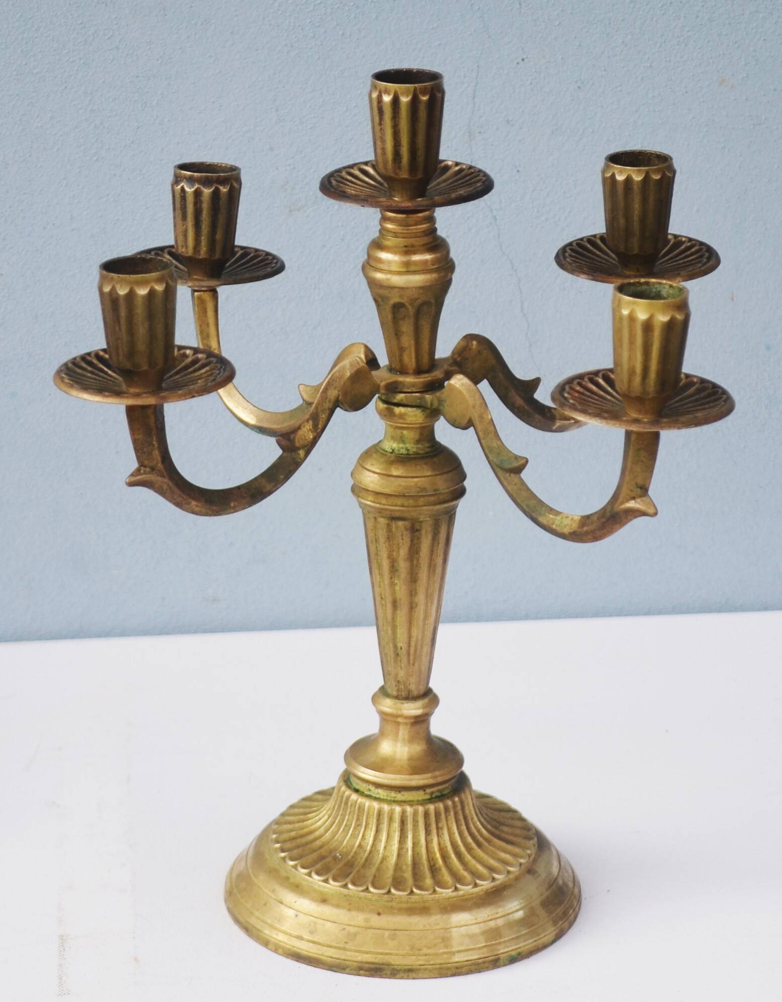 Solid brass candle holder with 5 candles and 4 arms