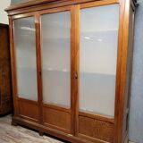 Large pine bookcase with three doors, fitted with frosted glass.