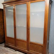 Large pine bookcase with three doors, fitted with frosted glass.