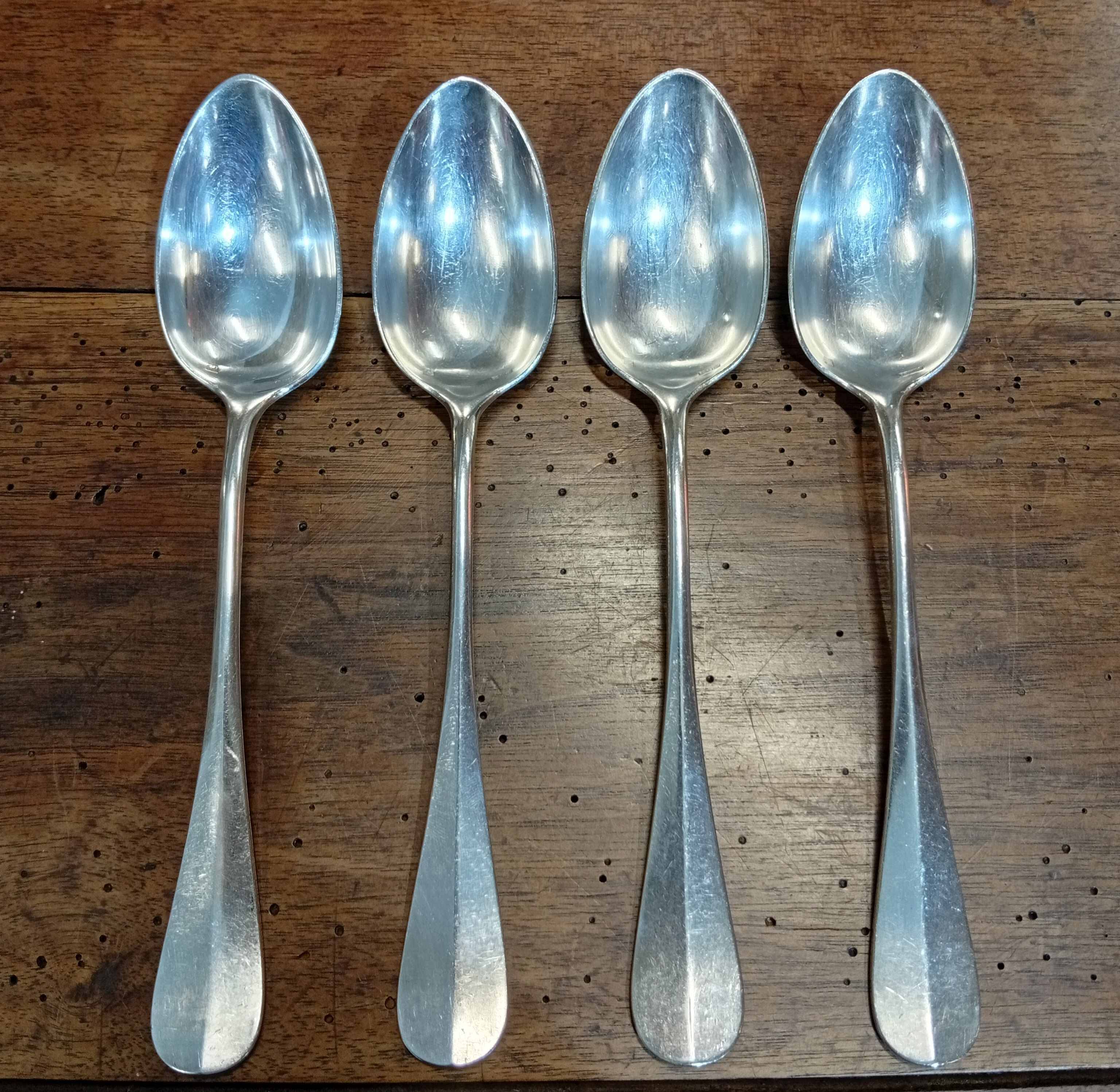 Set of 4 large spoons in the Vieux Paris style in silver-plated metal.