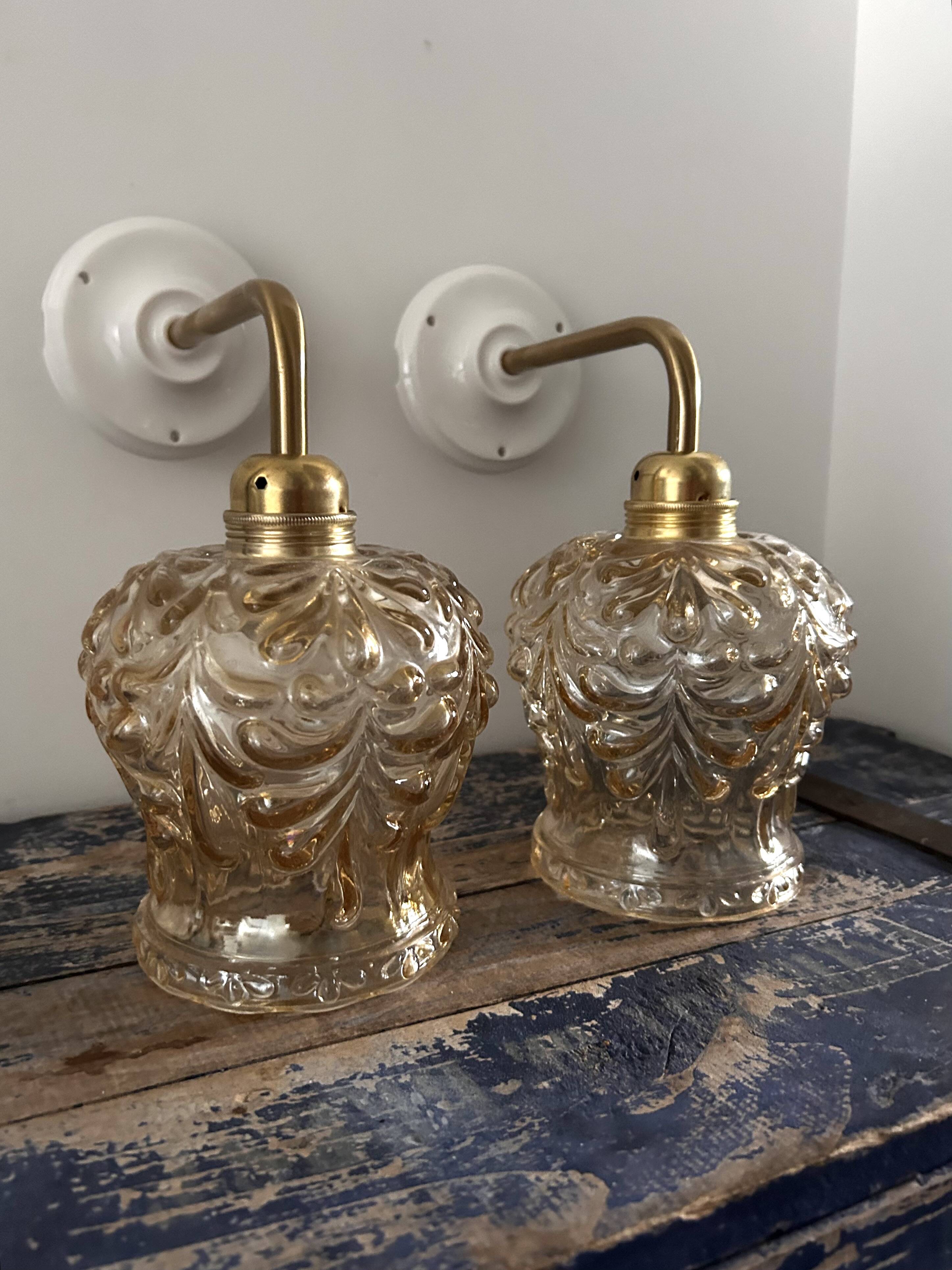 Set of two vintage amber glass wall lights