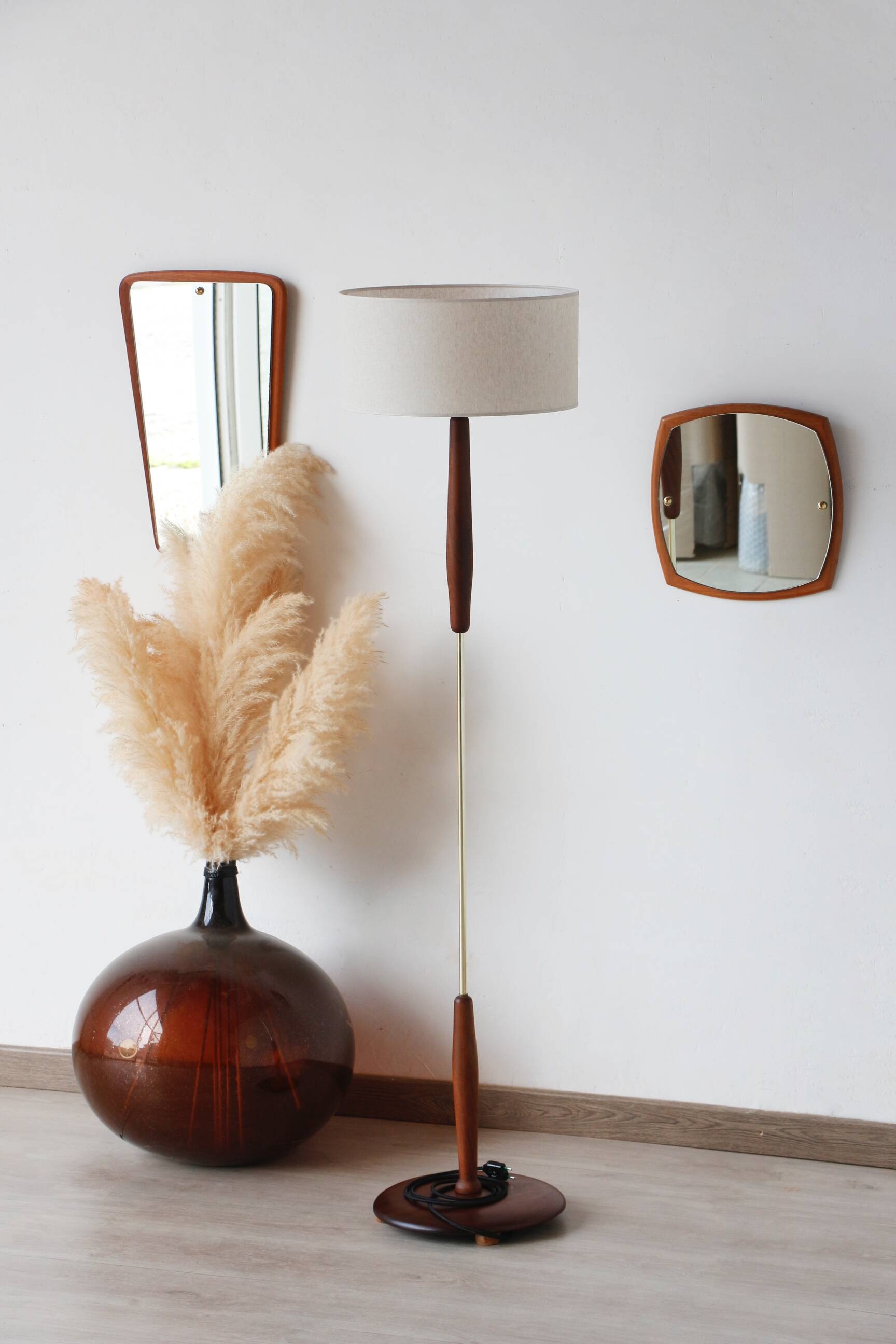 Vintage floor lamp in teak and brass with a cream shade.