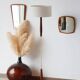 Vintage floor lamp in teak and brass with a cream shade.