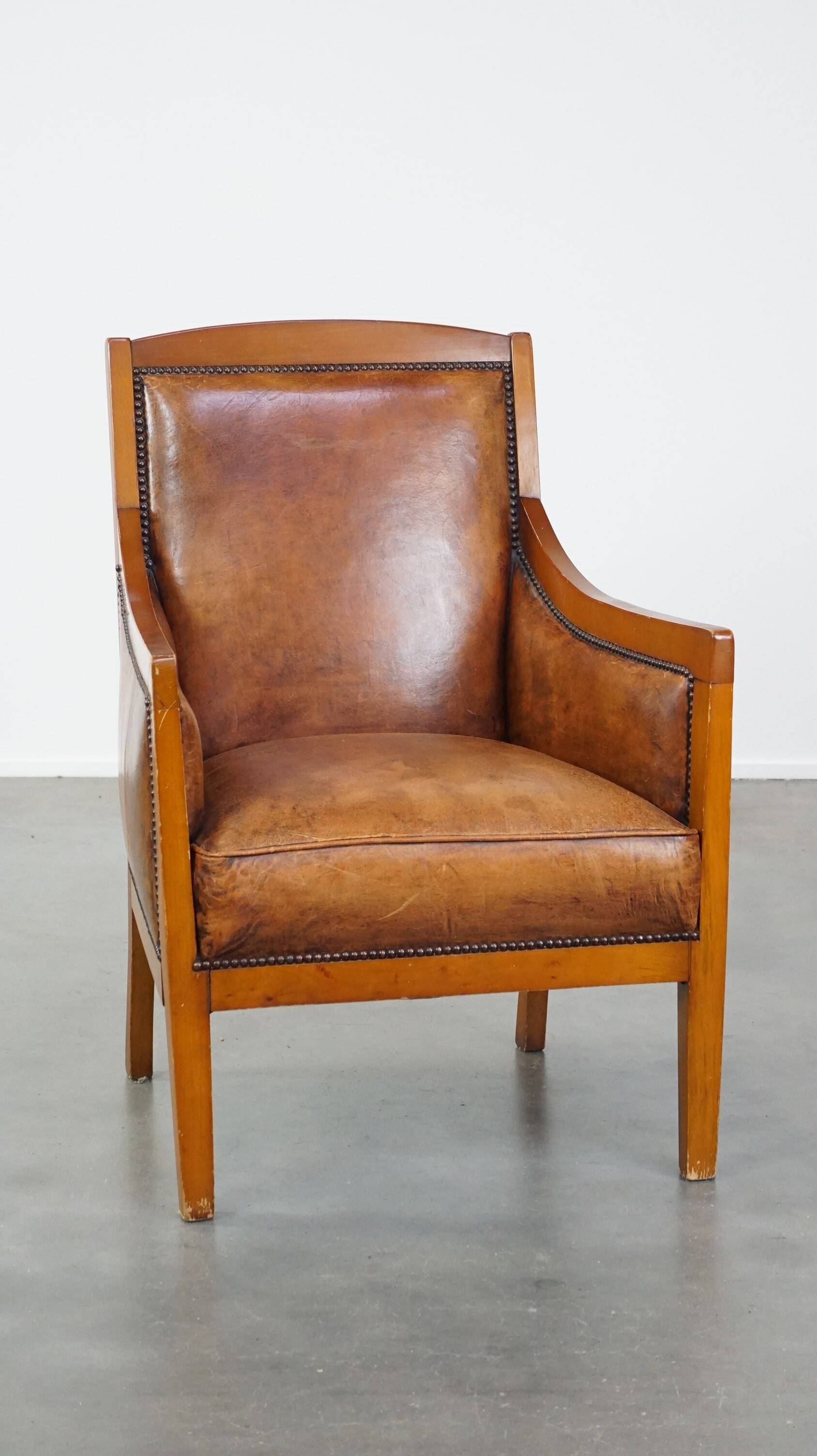 Sheep leather Art Deco design armchair combined with wood