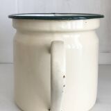 Old milk jug in enameled sheet metal