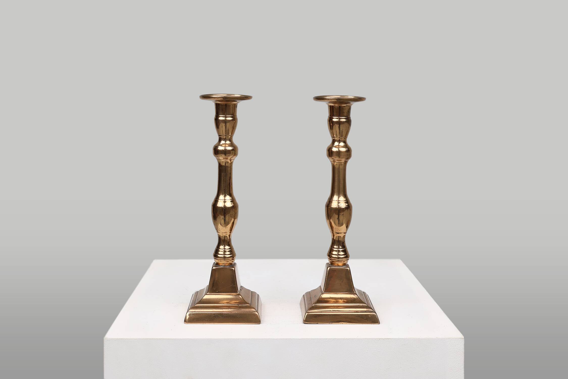 Pair of two French antique candlesticks in bronze, ca. 1890