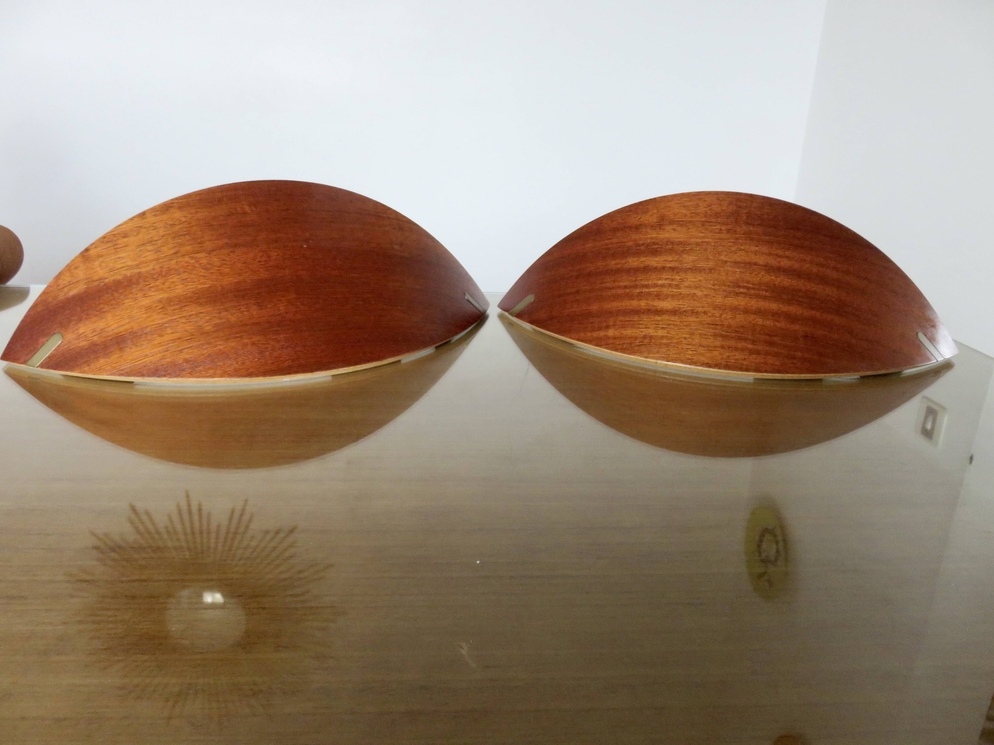 Pair of Scandinavian wall lights in bent wood with brass accents, 1980.