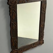 Arts & Crafts hand-carved wall mirror with floral roses, early 20th century