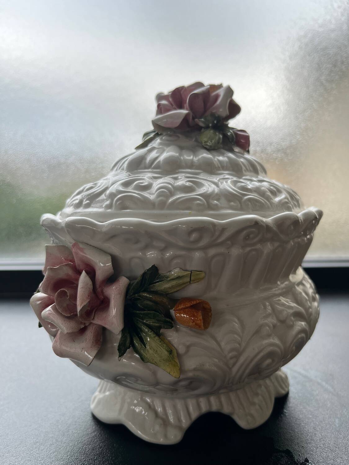 Capodimonte-style porcelain lidded sugar bowl with floral relief