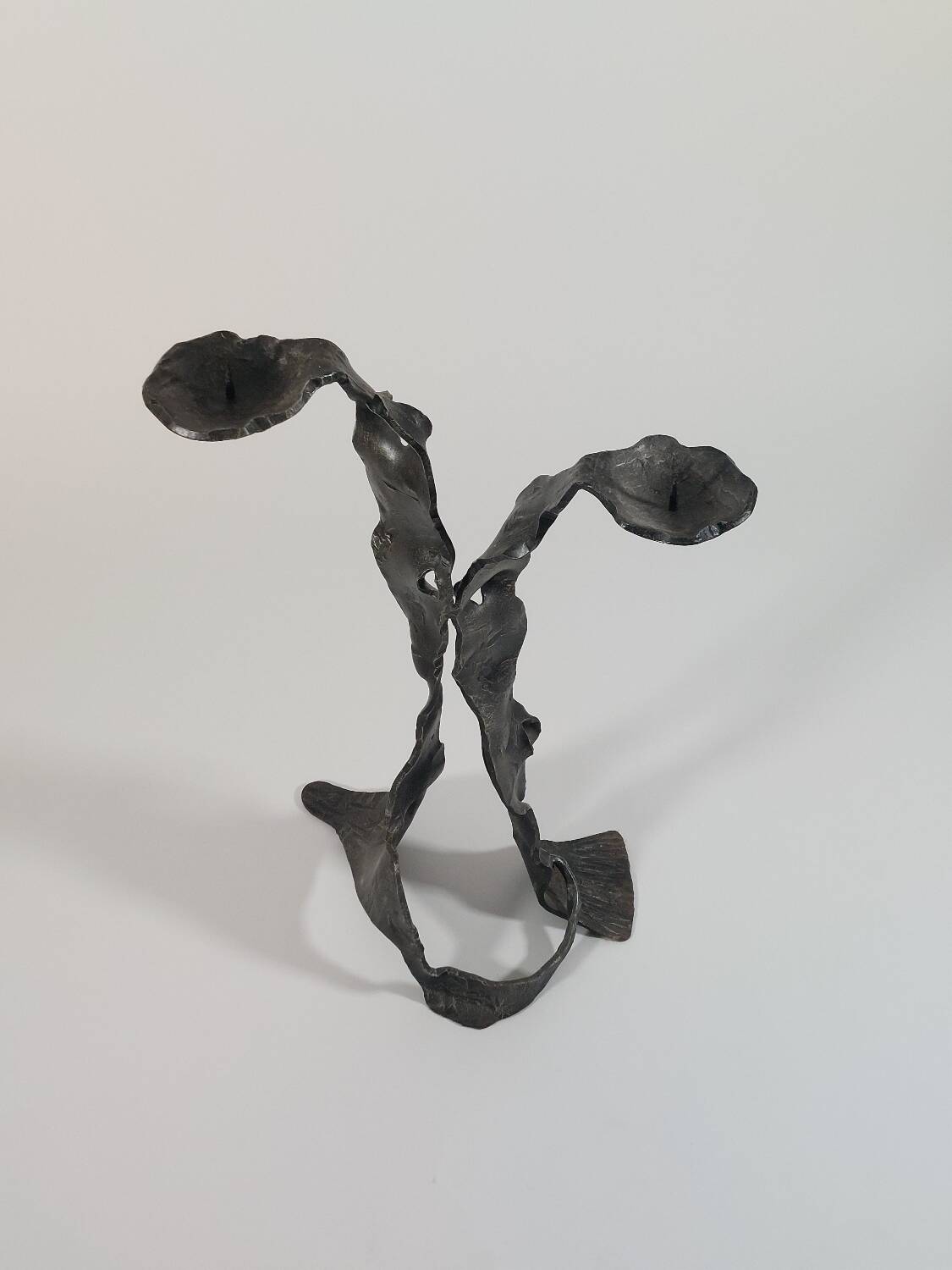 Sculptural brutalist floor candle holder made of hand-forged iron from the 1950s.