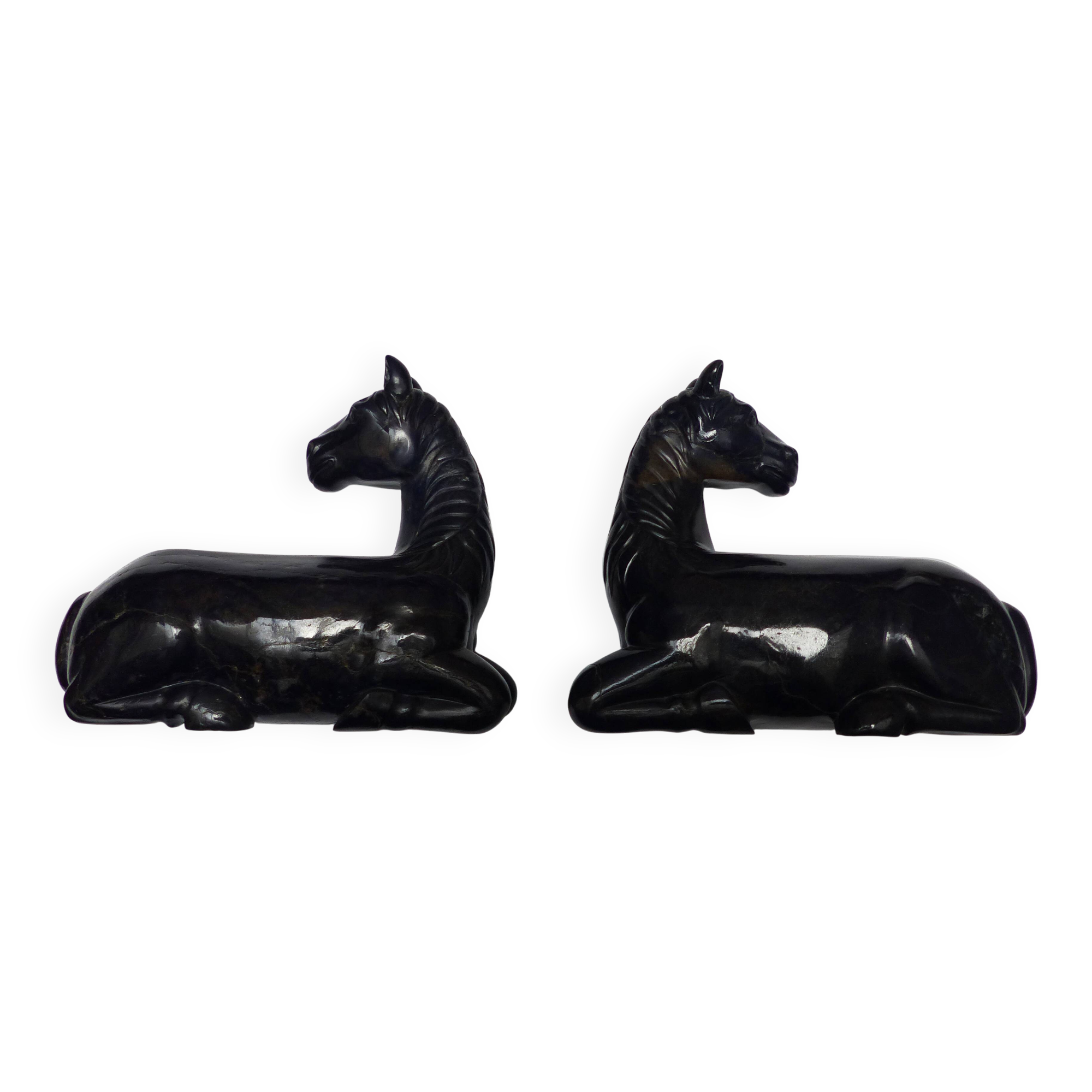 Black marble bookends with lying horses