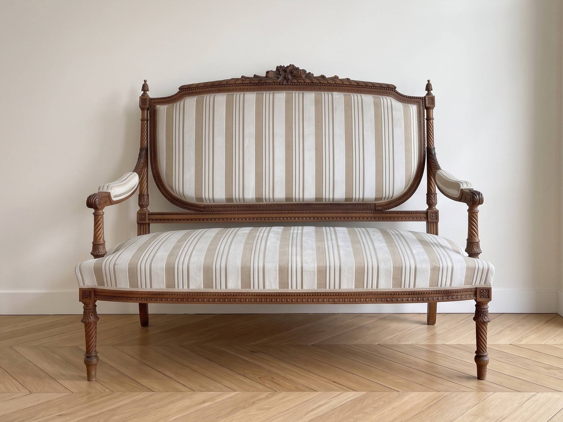 Louis XV style classic canapé reupholstered in striped beige fabric.