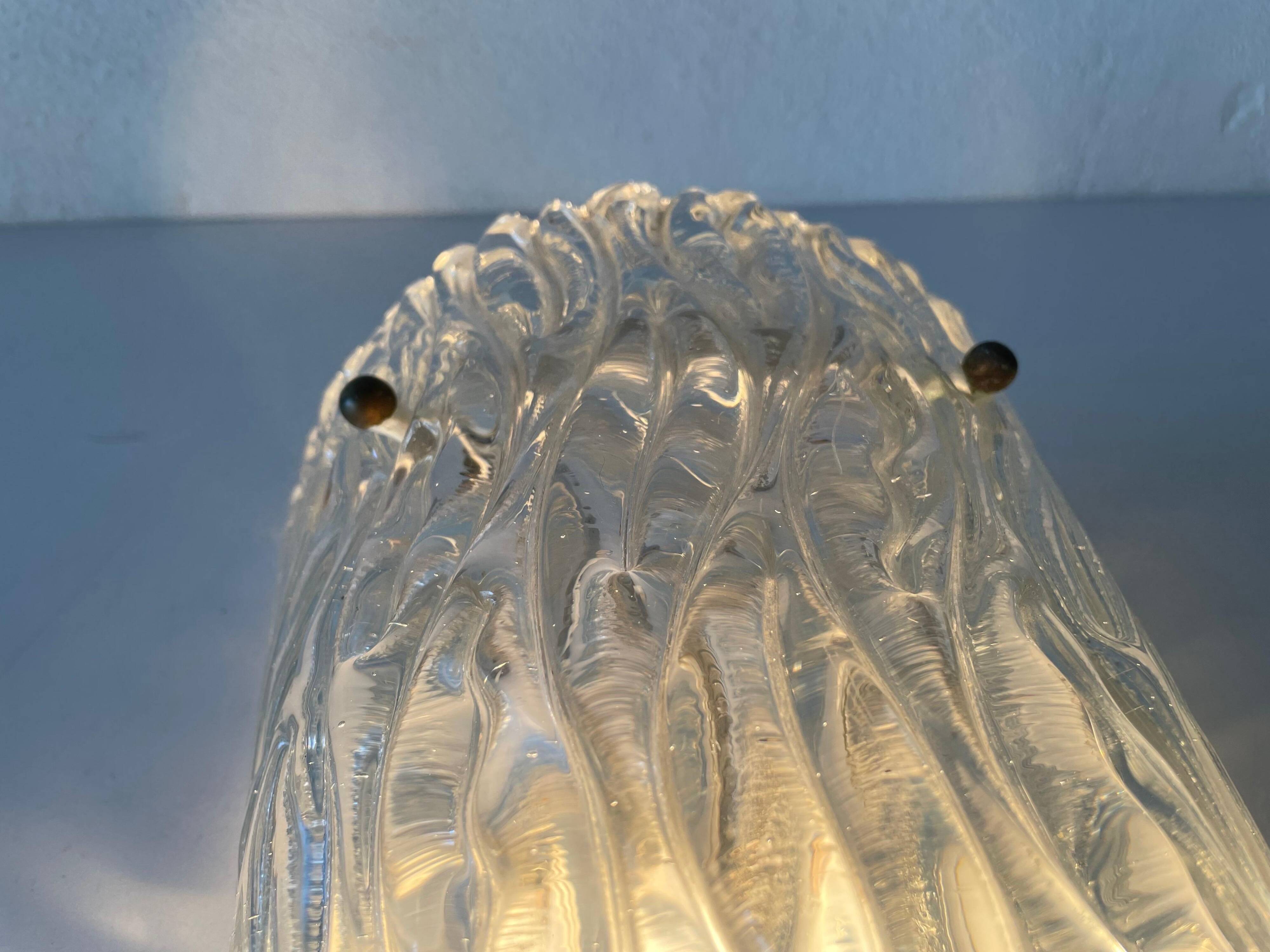 Simple arch-shaped wall light in textured glass, 1950s, Germany.