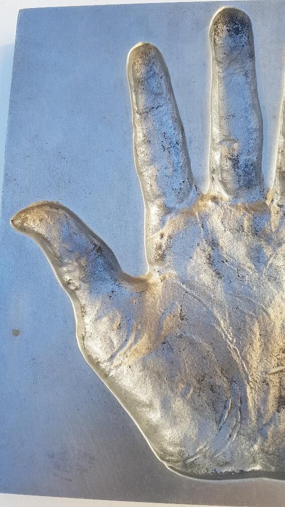 Trinket bowl hand print in 1970s aluminum