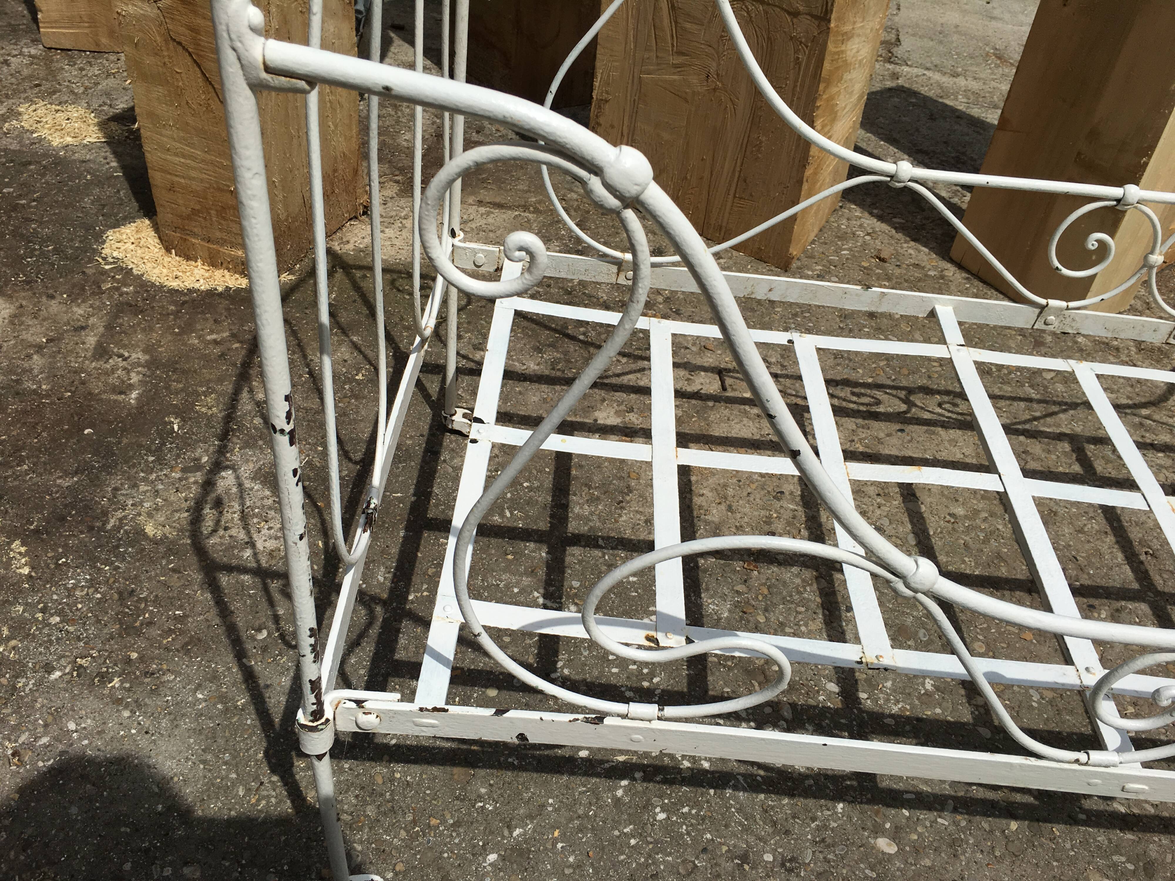 Ancient white metal bed