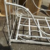 Ancient white metal bed