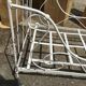 Ancient white metal bed
